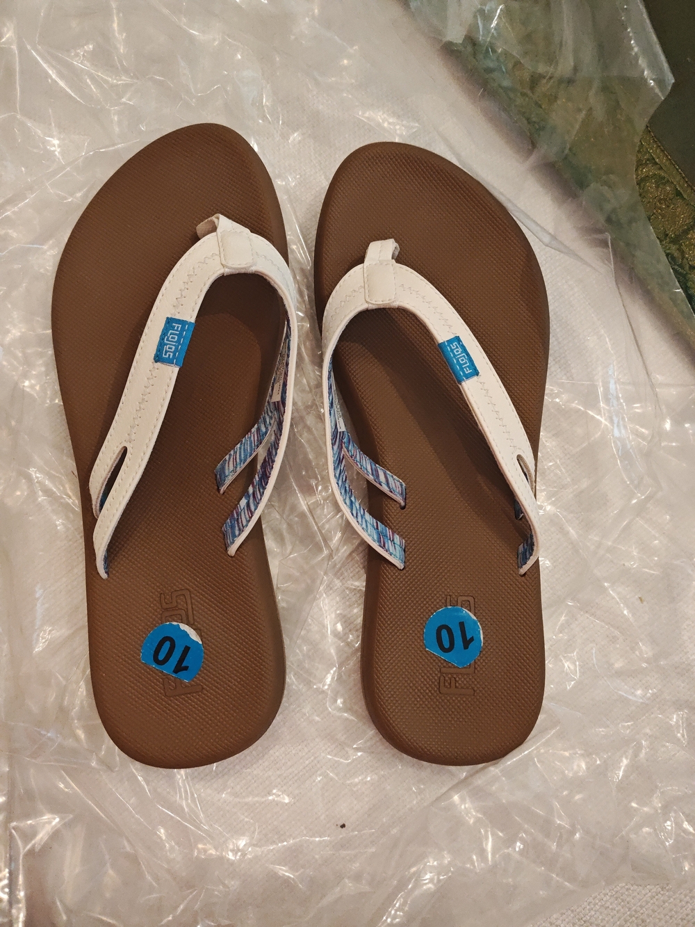 Flojos Brown Footbed White Strap Flip Flops with Blue Pattern Accents
